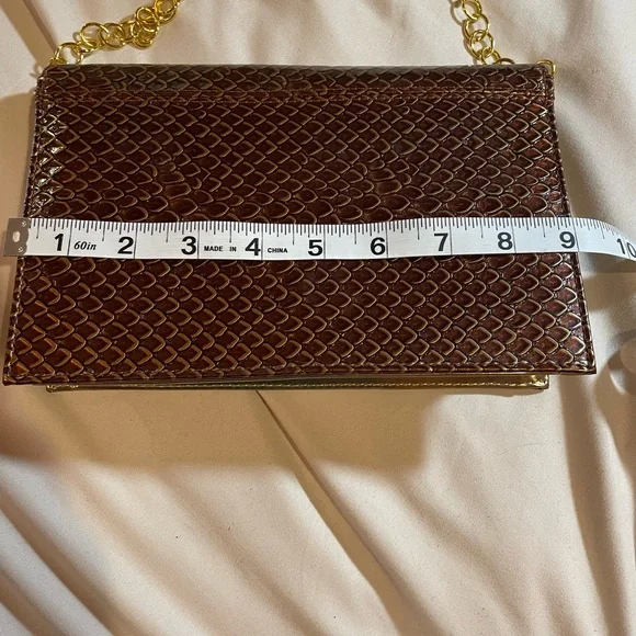 Bellini Gold Textured Clutch with Gold Chain and Bow Detail, OS - Picture 6 of 15